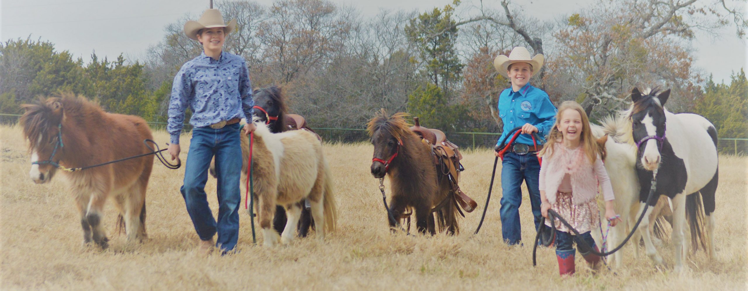 The Deary children with their ponies